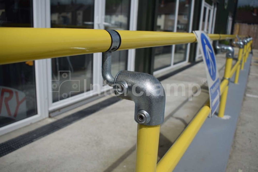 DDA tube clamp fittings used for pedestrian handrail along retail entrance